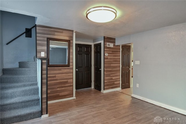 foyer with wood-type flooring