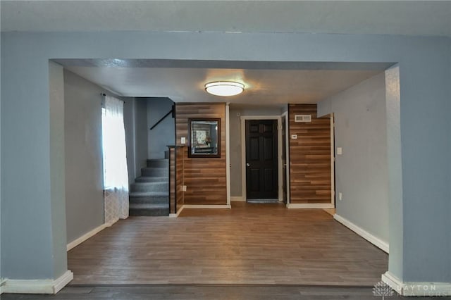 foyer with dark wood-type flooring