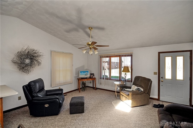 living room featuring lofted ceiling, carpet flooring, and ceiling fan