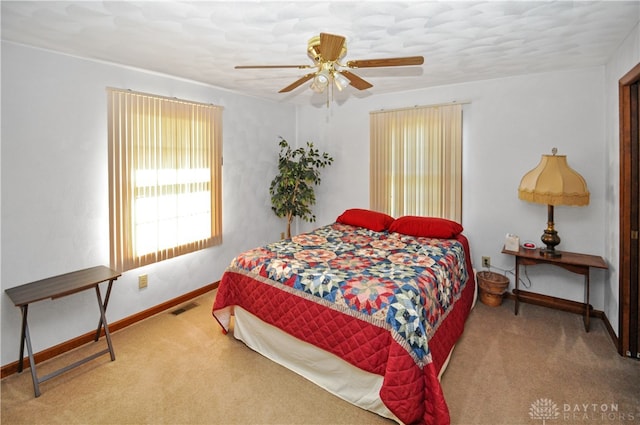 carpeted bedroom with ceiling fan