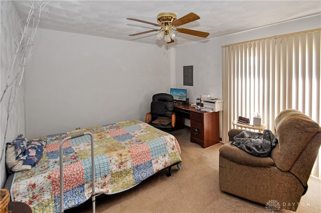 carpeted bedroom featuring electric panel and ceiling fan