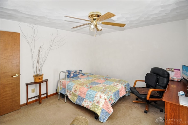 bedroom featuring light colored carpet and ceiling fan