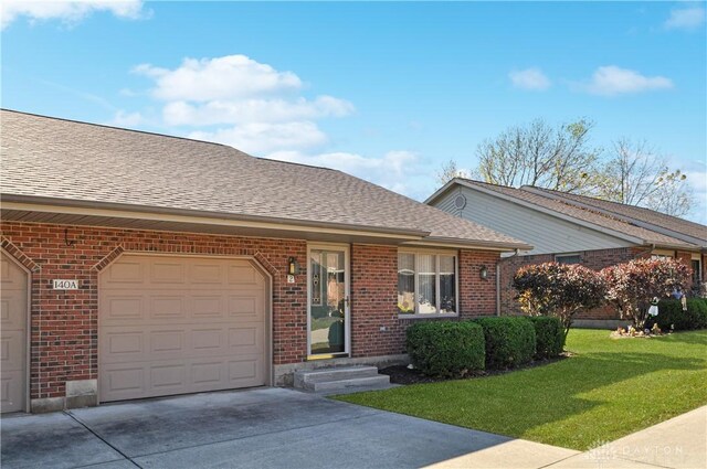 single story home with a front yard and a garage