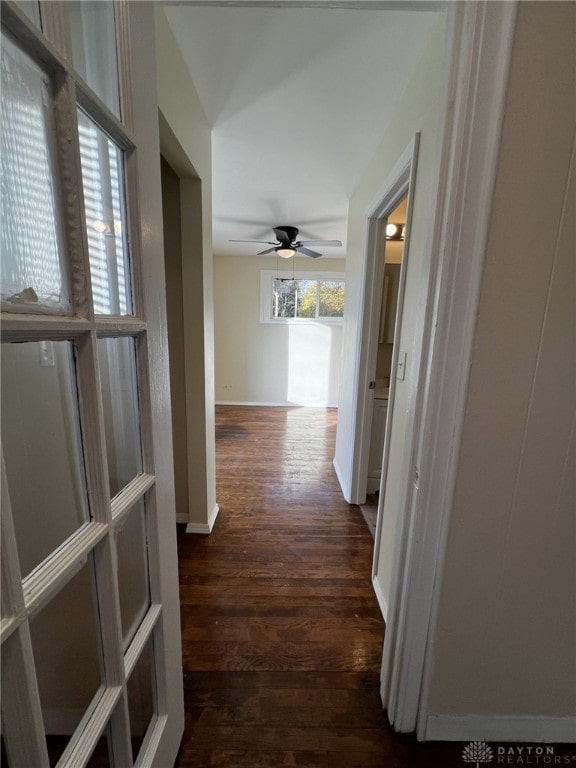 hallway with dark wood-type flooring