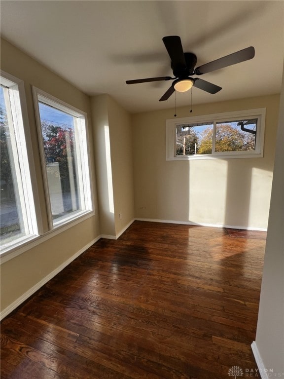 spare room featuring dark wood-type flooring