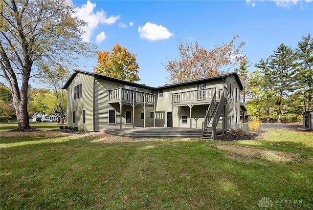 back of house with a deck, a lawn, and stairs