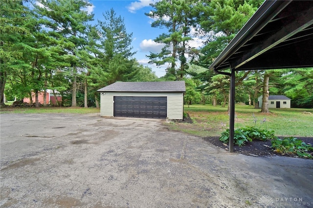 garage featuring a lawn