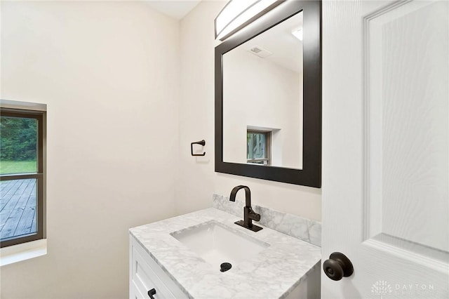 bathroom with visible vents and vanity