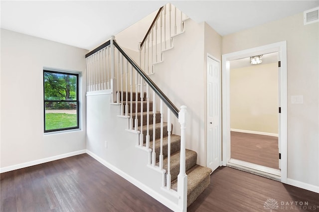 stairway with wood-type flooring