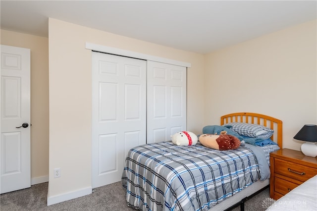 bedroom featuring a closet and carpet floors