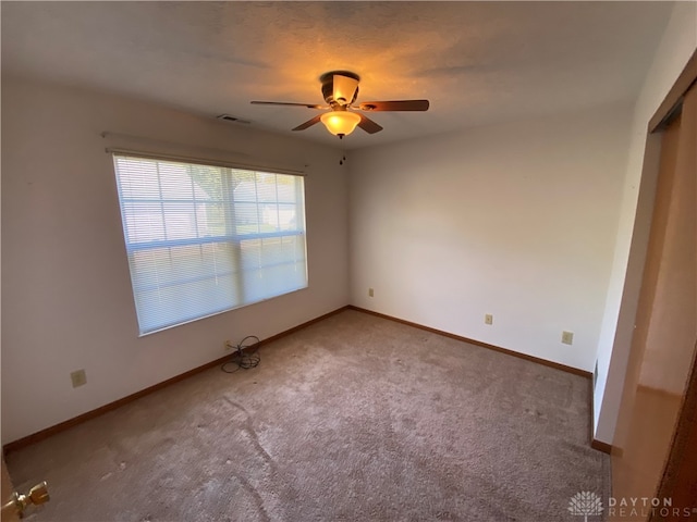 unfurnished bedroom featuring carpet, a closet, and ceiling fan