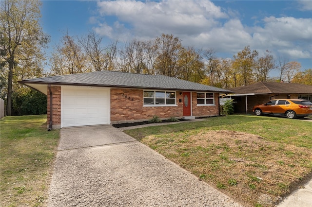 ranch-style home featuring a garage and a front lawn