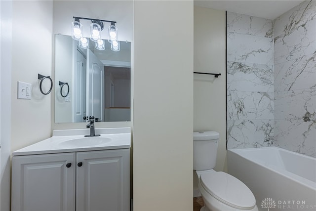 full bathroom with toilet, vanity, and tiled shower / bath