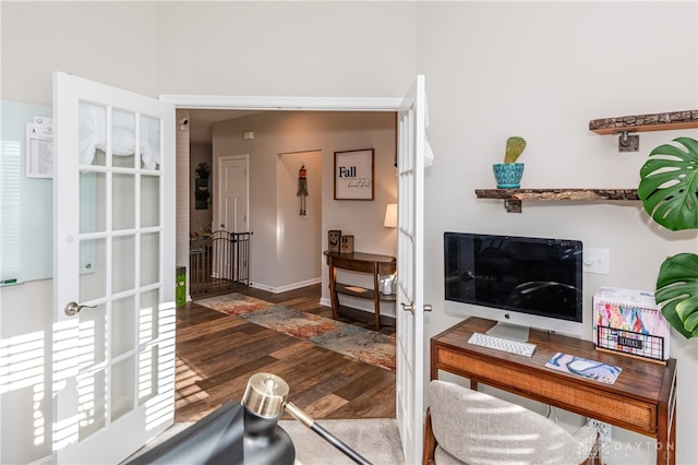 home office with french doors and dark hardwood / wood-style floors