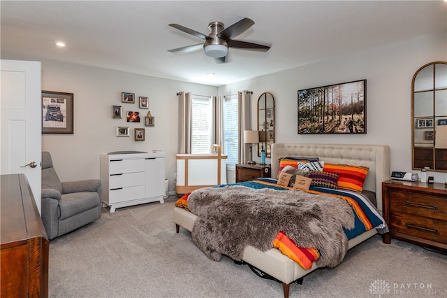 carpeted bedroom featuring ceiling fan