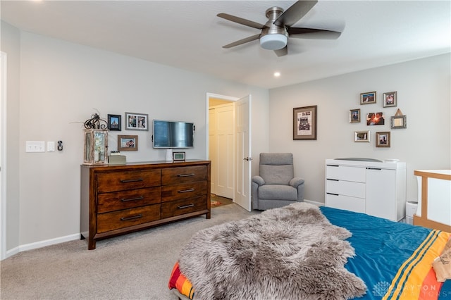 bedroom with light carpet and ceiling fan