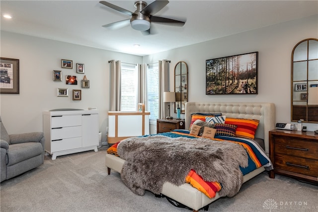 carpeted bedroom featuring ceiling fan