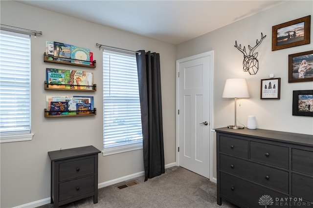 bedroom featuring light colored carpet