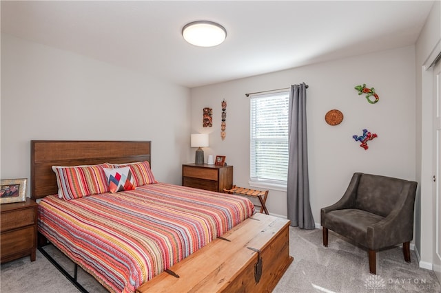 bedroom with light colored carpet