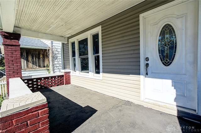 property entrance with covered porch