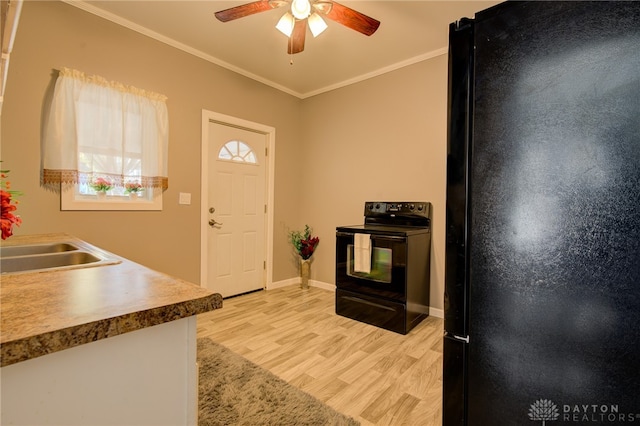 kitchen with black appliances, sink, ceiling fan, ornamental molding, and light hardwood / wood-style flooring