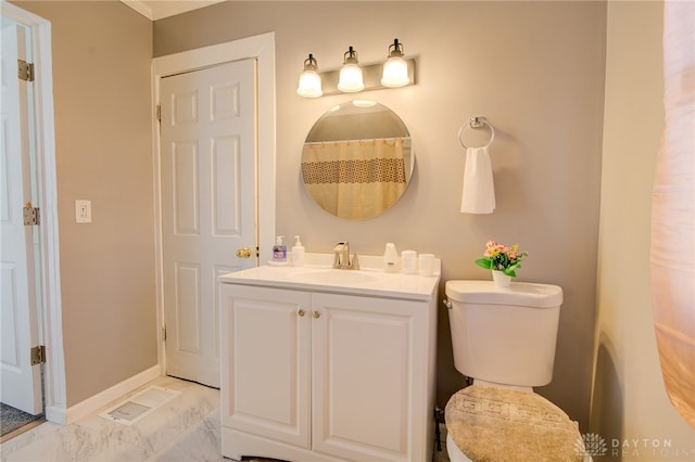 bathroom with toilet and vanity