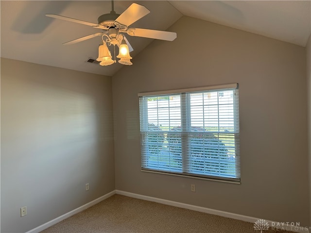 unfurnished room featuring carpet floors, lofted ceiling, and ceiling fan