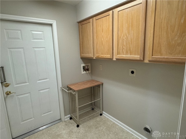 clothes washing area with hookup for a washing machine, cabinet space, baseboards, and electric dryer hookup