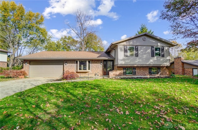 split level home with a garage and a front lawn