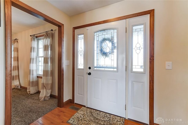 foyer with hardwood / wood-style flooring and plenty of natural light