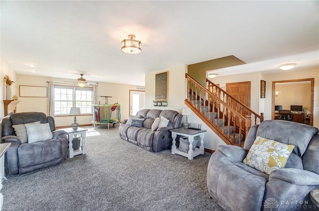 living room featuring ceiling fan and carpet floors