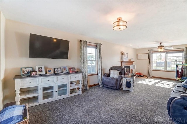 living room with ceiling fan and carpet floors