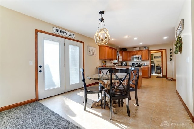 dining space with light tile patterned floors and plenty of natural light