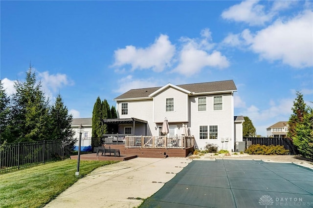 back of property featuring a lawn, a patio area, a pool side deck, and cooling unit