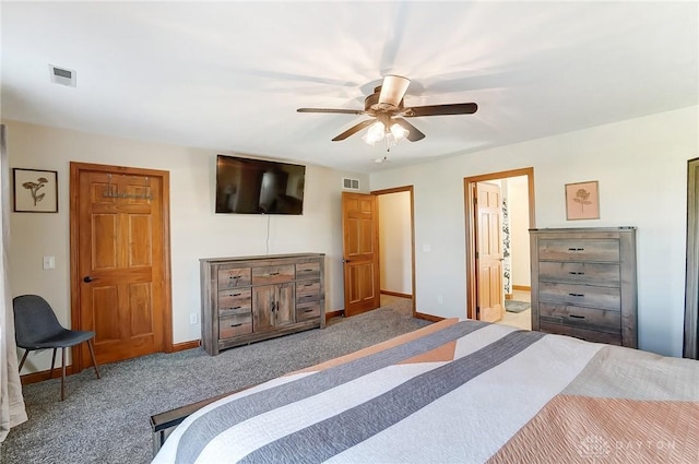 bedroom with carpet, ceiling fan, and ensuite bathroom