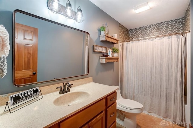 full bathroom featuring tile patterned floors, shower / bathtub combination with curtain, vanity, and toilet