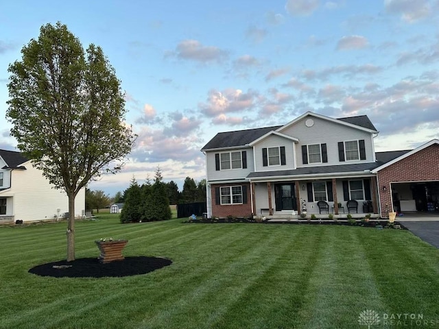 view of front facade with a front yard and a porch