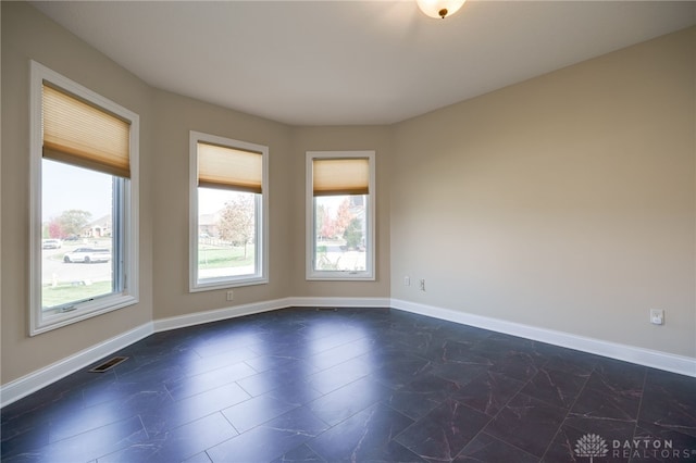 empty room featuring plenty of natural light