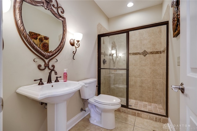 bathroom featuring toilet, walk in shower, and tile patterned flooring