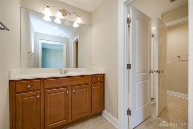 bathroom with vanity and tile patterned flooring