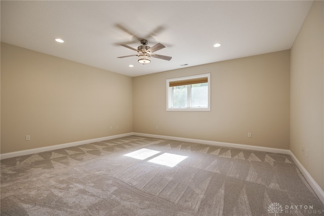 spare room with carpet flooring and ceiling fan