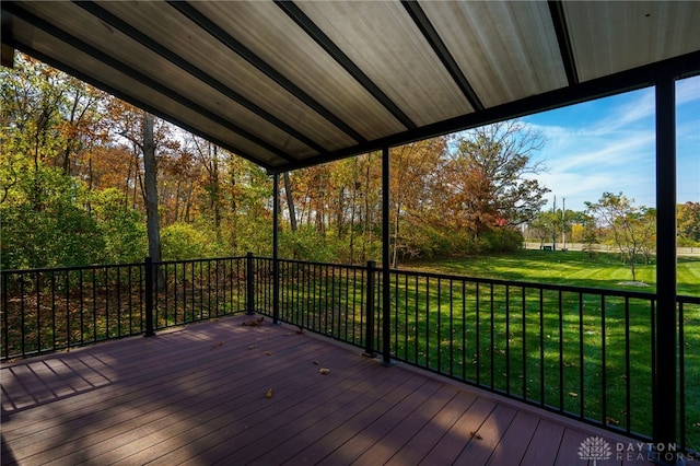 wooden deck with a lawn