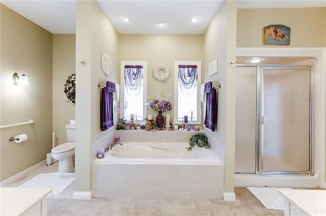 full bathroom featuring vanity, toilet, and independent shower and bath