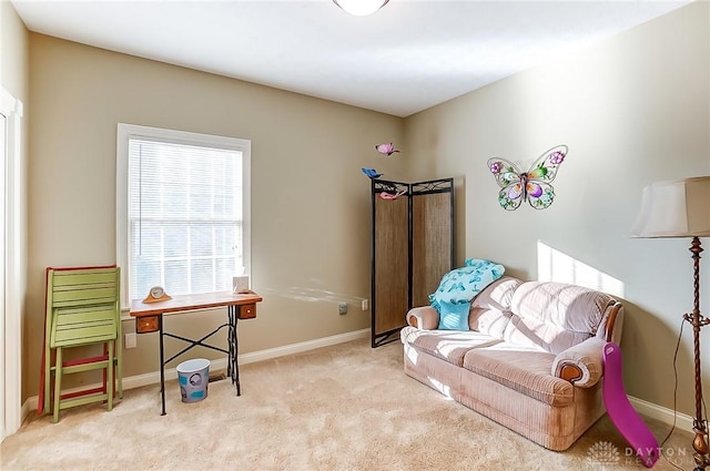 sitting room with light colored carpet