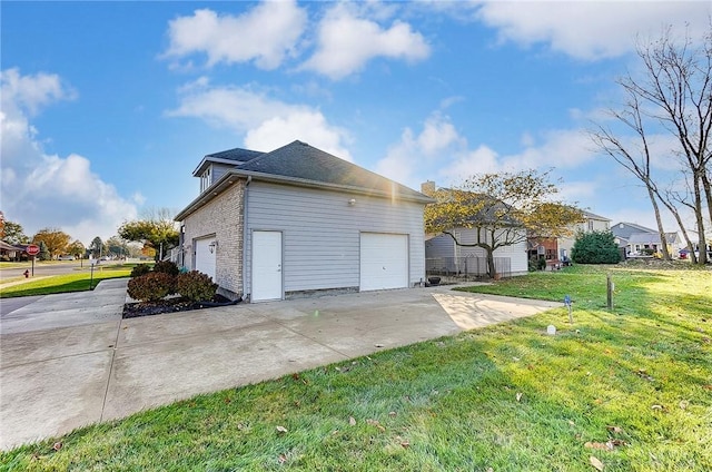 view of property exterior with a lawn and a garage