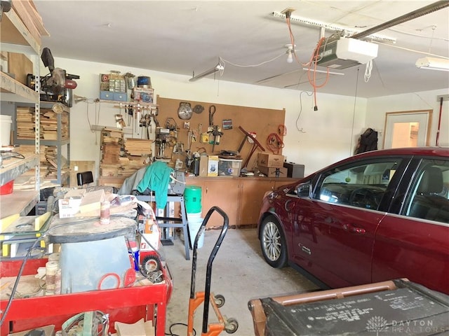 garage featuring a workshop area and a garage door opener