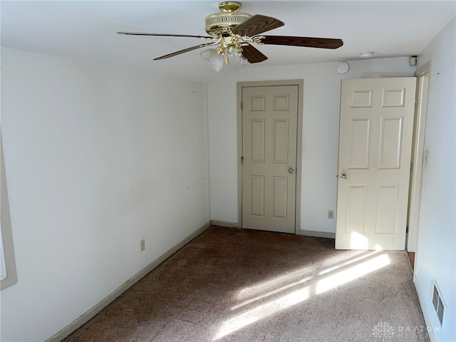 unfurnished bedroom featuring carpet floors and ceiling fan