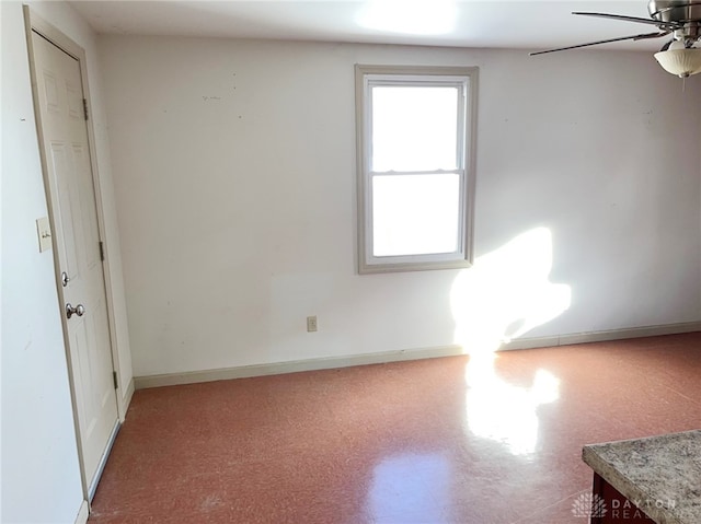 spare room featuring ceiling fan