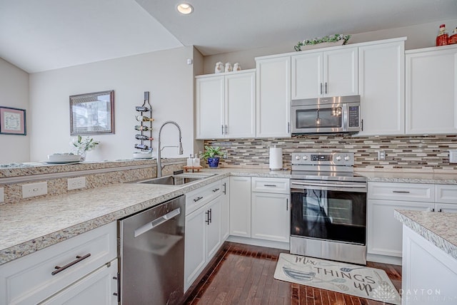 kitchen featuring white cabinets, stainless steel appliances, sink, and dark hardwood / wood-style flooring