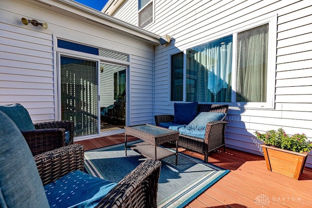 wooden deck featuring an outdoor hangout area